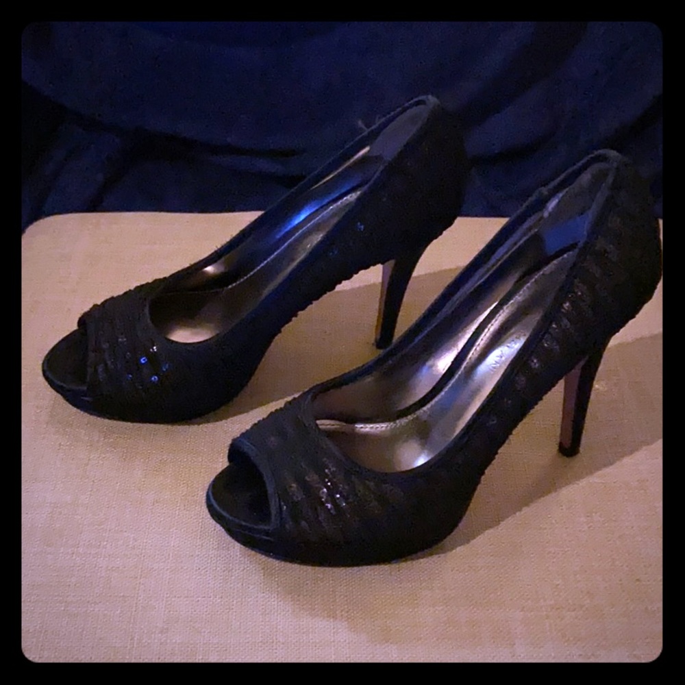 Black Antonio Melani peep toe pumps.
